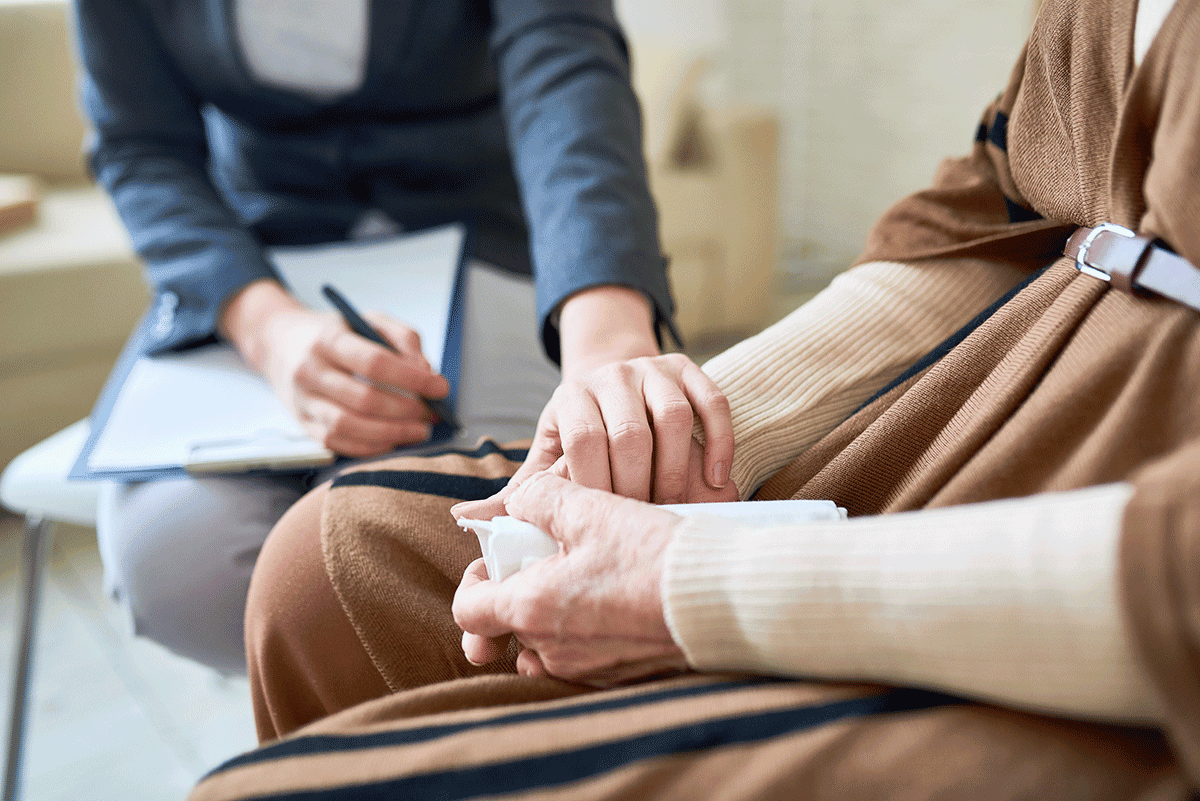 Hands of two people discussing the myths and facts about trauma