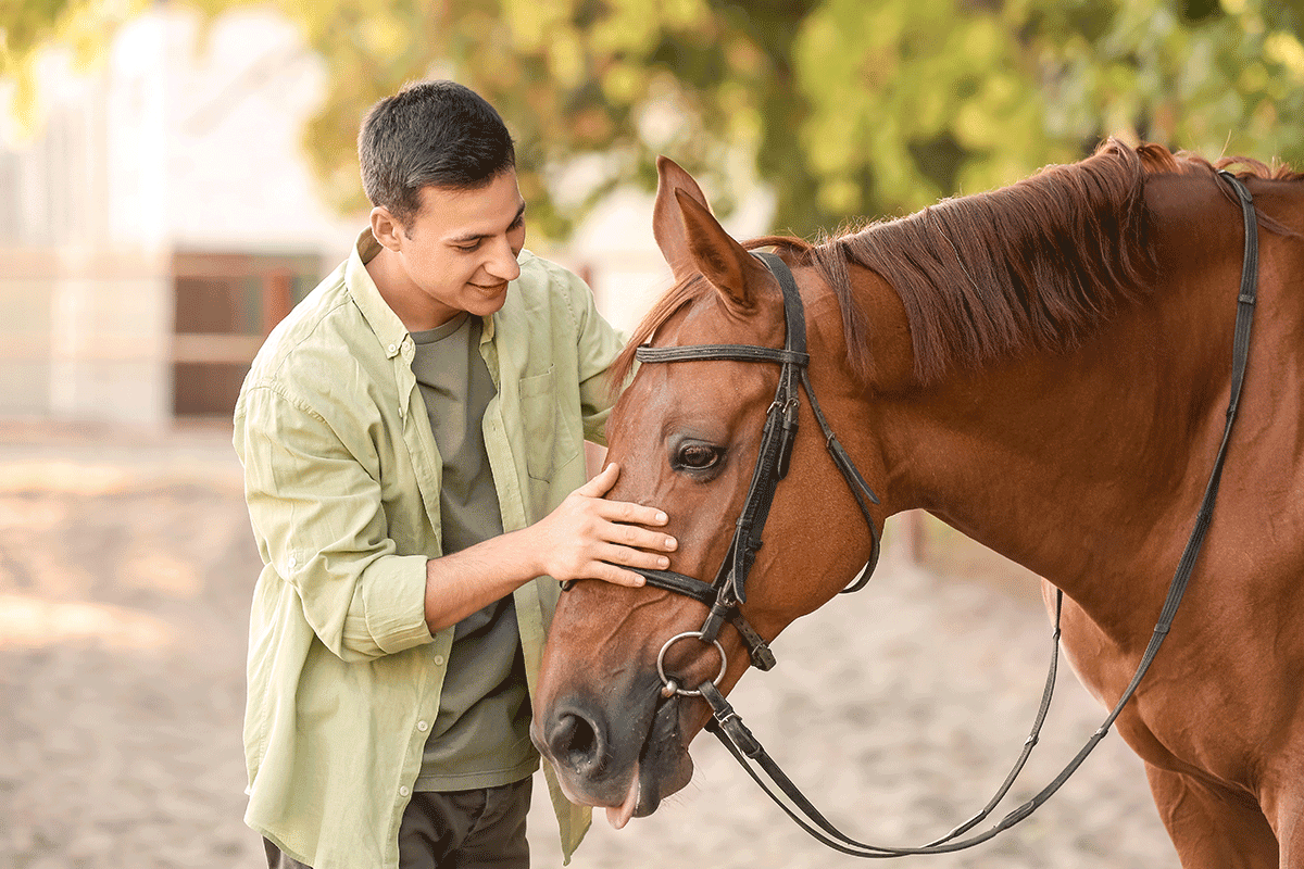 Person with horse, wondering, "Is equine therapy effective?"