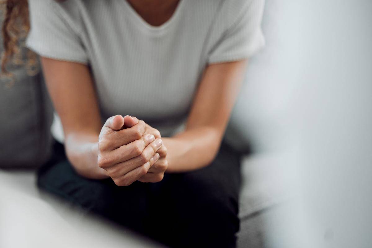 Hands of a person learning about the benefits of an alcohol detox center