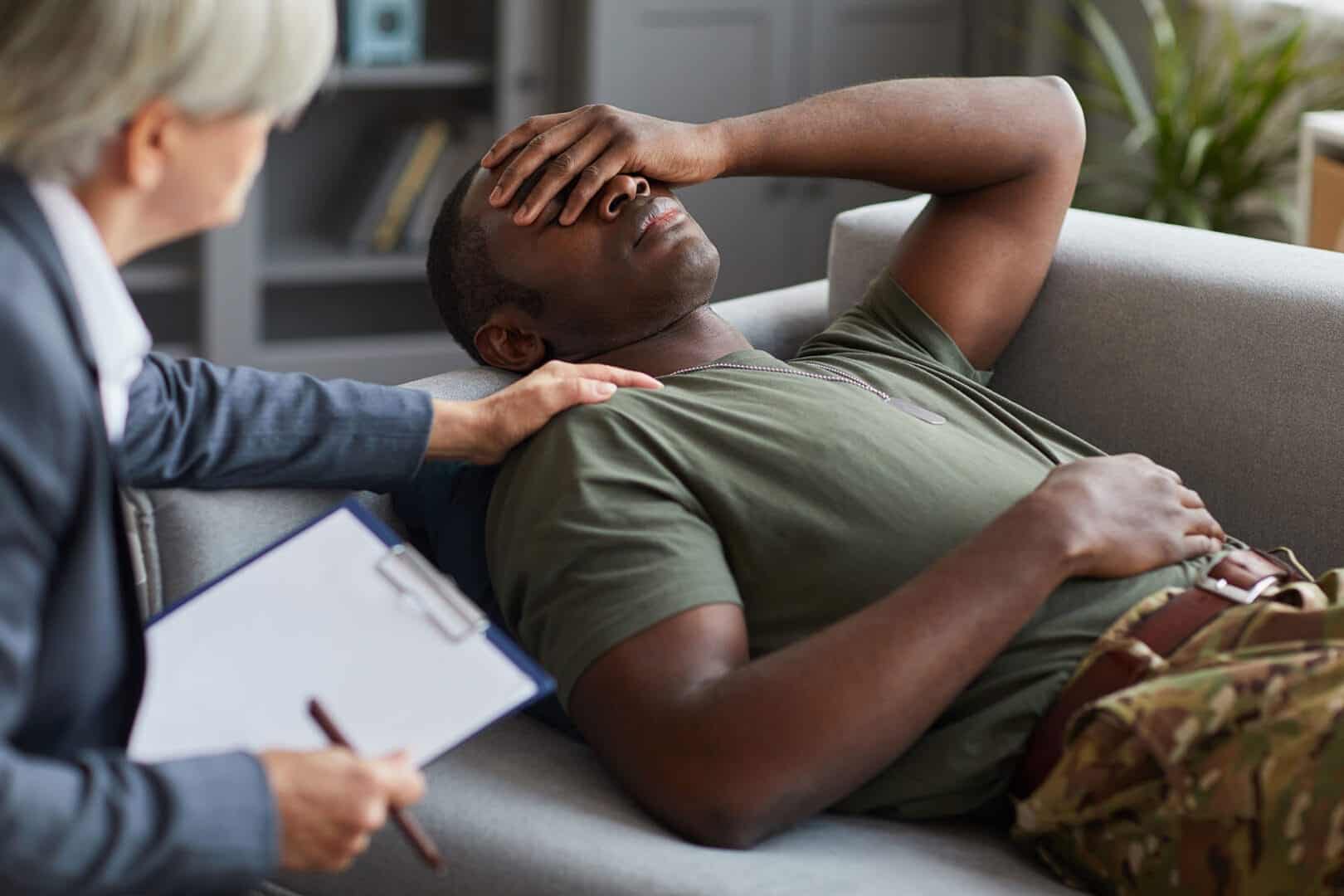 Person talking to their therapist about PTSD and substance abuse