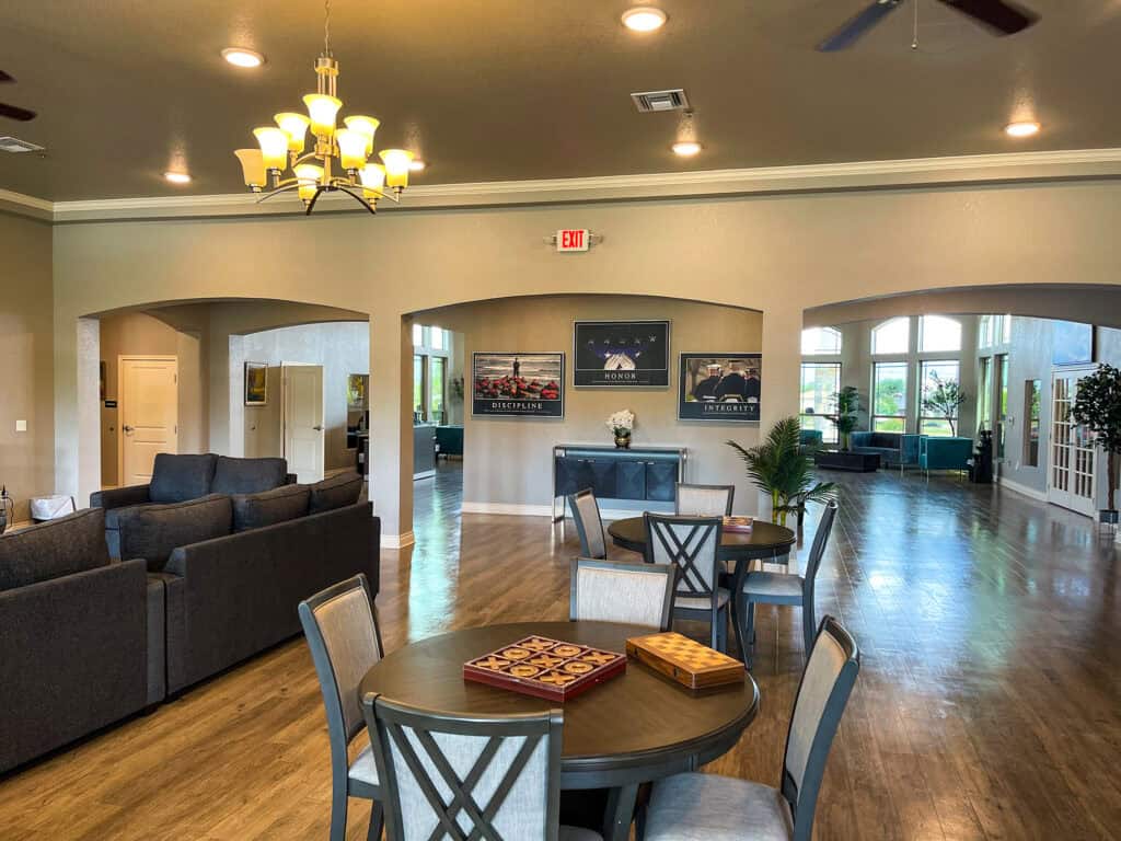 Virtue Recovery Center Killeen Chair and Table next to Couches
